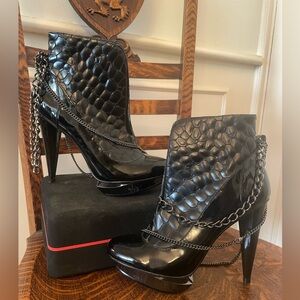 Velvet Angels Black Patent Stiletto "Ferox" Platform Booties with Chains